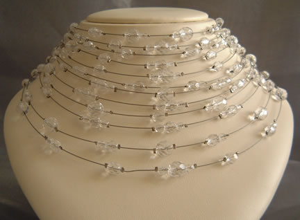 12 Strand graduated choker necklace on gold illusion wire