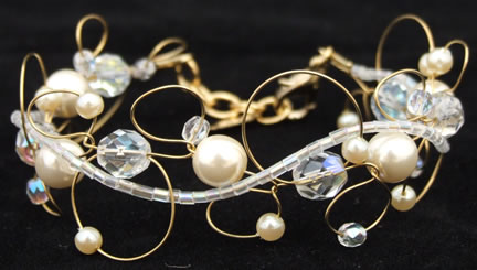 AB Crystals and Ivory Glass Pearls Bracelet in Gold