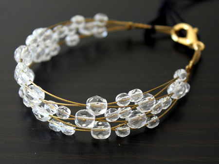 Gold Wire Bracelet Interwoven with Plain Crystal 
